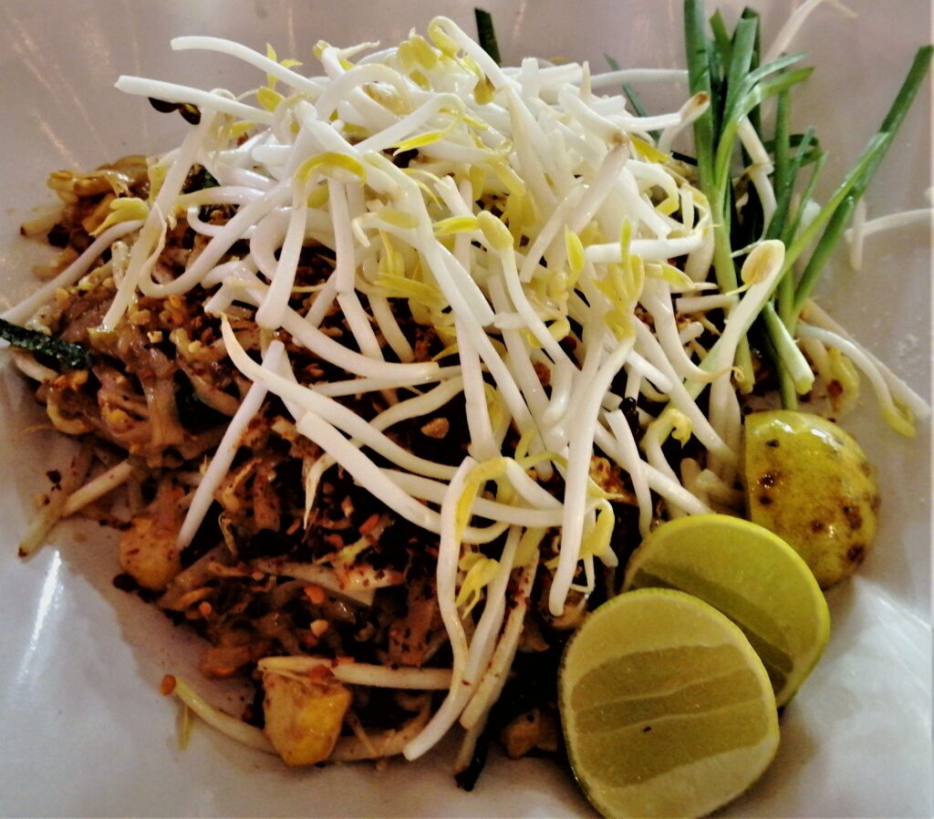 Cuisine close up.  Sprouts, limes, tofu, green onions and veggies, a beautiful Thai dish.  From Post: Thai Sounds With Food Words: Memory Enhancement Through Imagination.