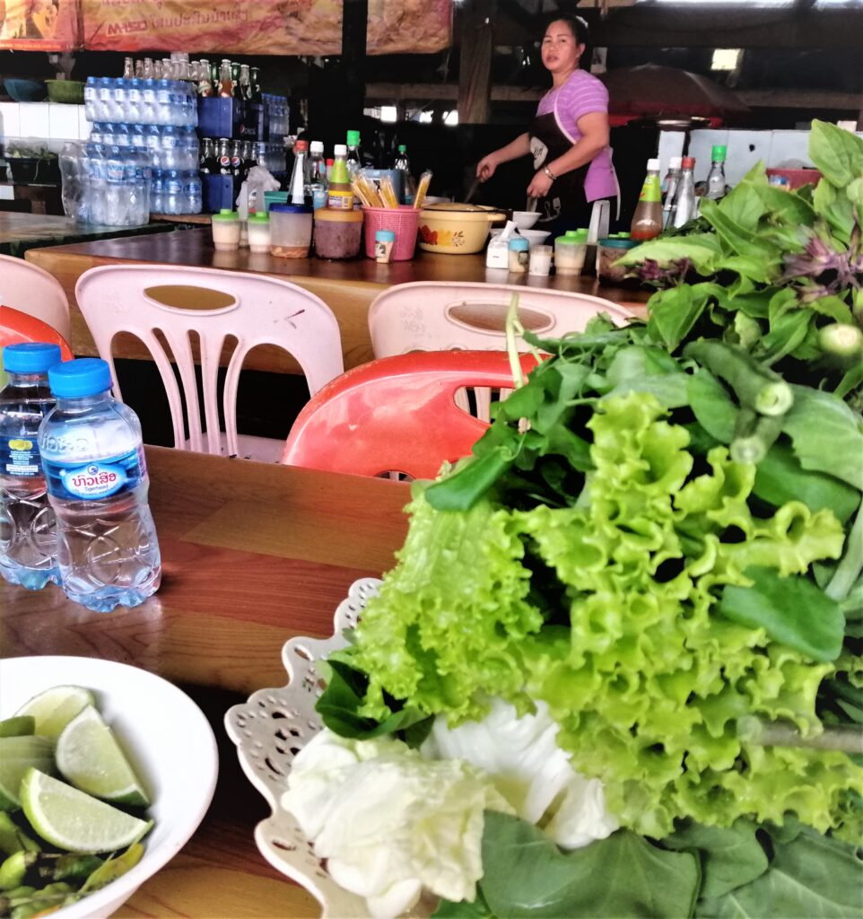 Soup spot and woman hawker during the day time. From the post: Luang Namtha: Why I Spent a Week in a Virtual Ghost Town.