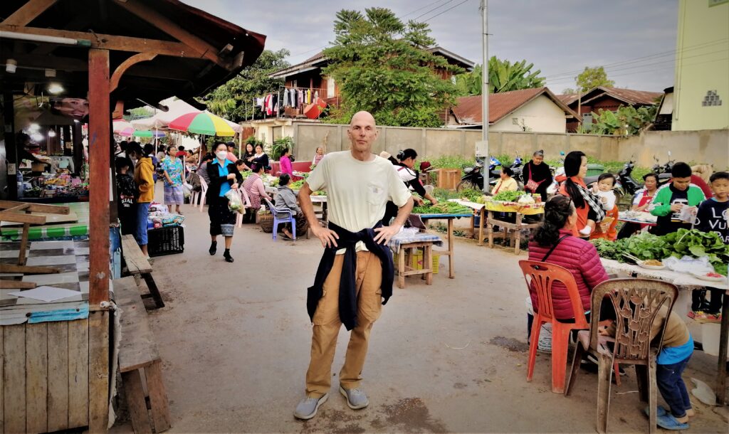 Me posing at the night market in Luang Namtha, Laos.  From the post: Luang Namtha: Why I Spent a Week in a Virtual Ghost Town.