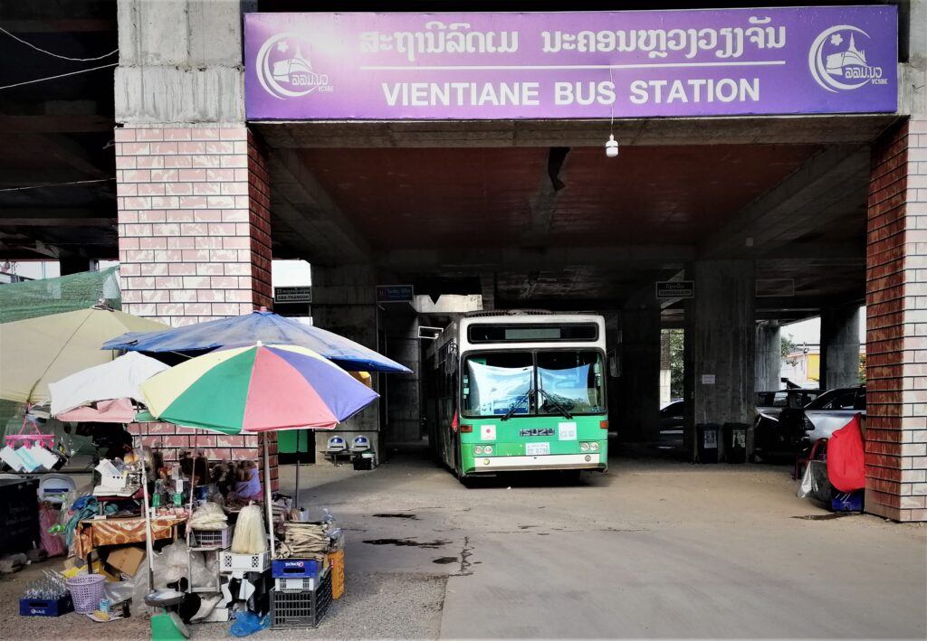 A bus ready to drive out Vientiane's  downtown city station.  In the post: how I traveled from Laos to Thailand for under three dollars.