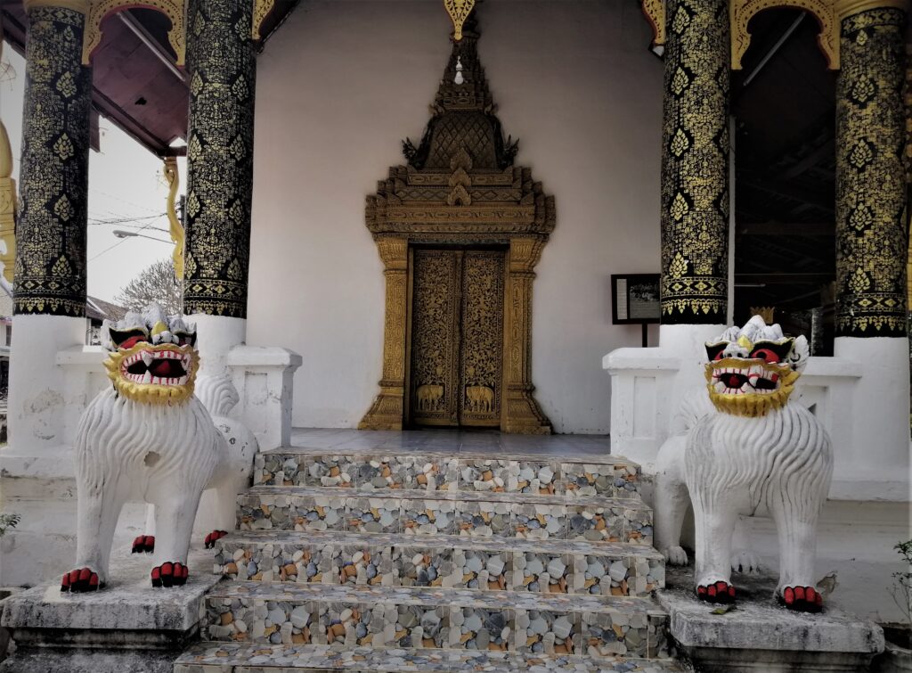 Hybrid animals in front of a magically constructed and decorated temple.