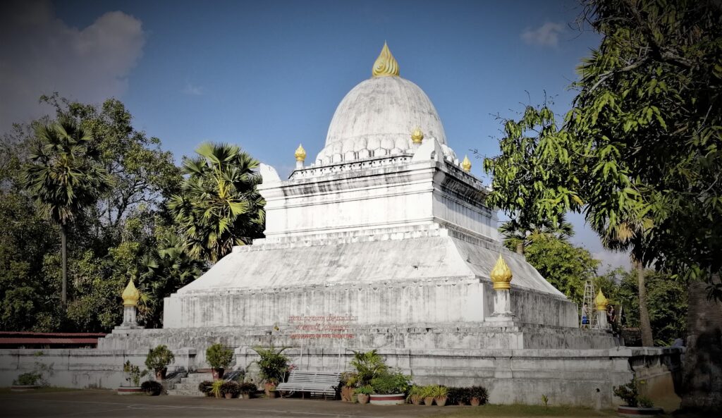 Massively wide archaic architecture sits on temple turf. In the post: Infinite Earth Art: Temples of Luang Prabang.