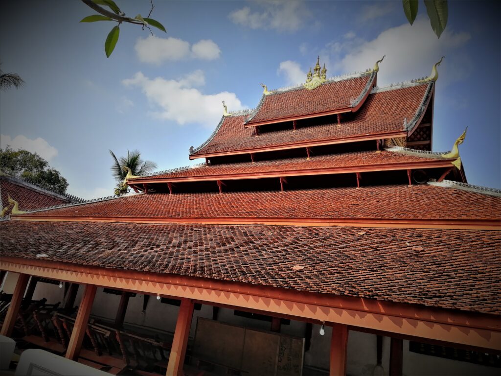 A temple which is a Buddhist-influenced dream building design of five cascading roofs of varied inlcines. In the post: Infinite Earth Art: Temples of Luang Prabang.