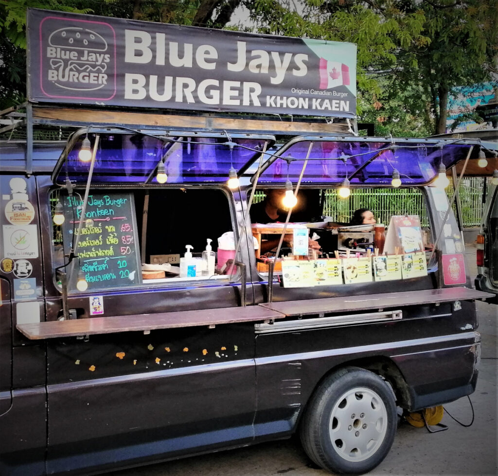Sign Blue Jays Burger outside at the Saturday night market in Khon Kaen.  From Post: Thai Sounds With Food Words: Memory Enhancement Through Imagination.
