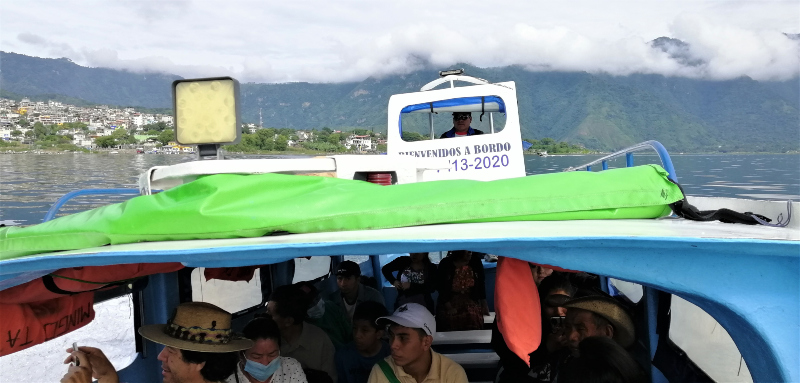 People on a passenger boat on Lago Atitlán in Guatemala.