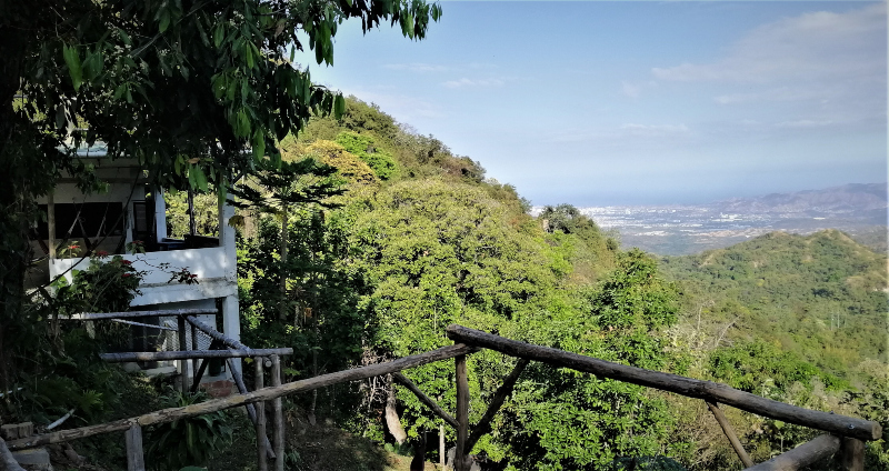 Optimism - A view of the Caribbean Sea and the lush foothills of the Sierra Nevada de Santa Marta mountains in Minca, Magdalena, Colombia