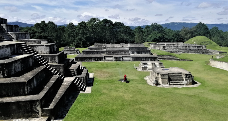 A woman performs an ancient prayer ritual at the Mayan historical site of Zaculeu, Guatemala