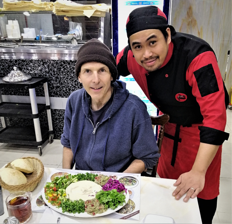 Me, the chef and a huge plate of raw vegan Turkish food at Neven Turkish Restaurant, Hafr al-Batin, Saudi Arabia.