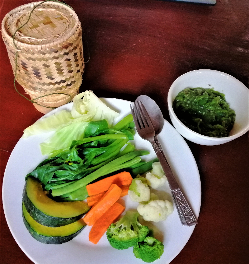 Typical Lao Food Mak Kaen Jeow Young Chili Pepper With Veggies and Sticky Rice.