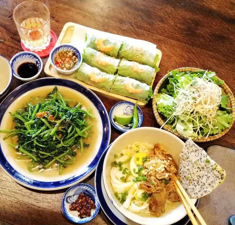 Colorful food spread, morning glory, fresh spring rolls and noodle soup, Da Nang, Vietnam