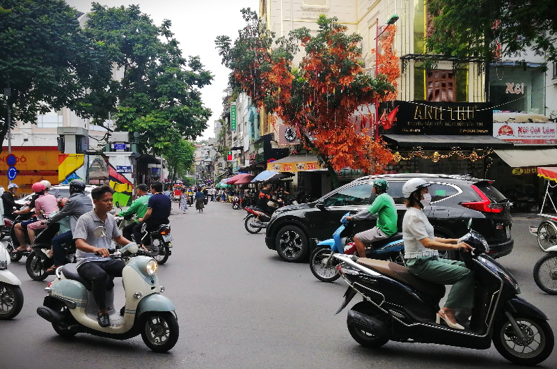 Scooters on a busy street in the Old Quarter, Hanoi, Vietnam