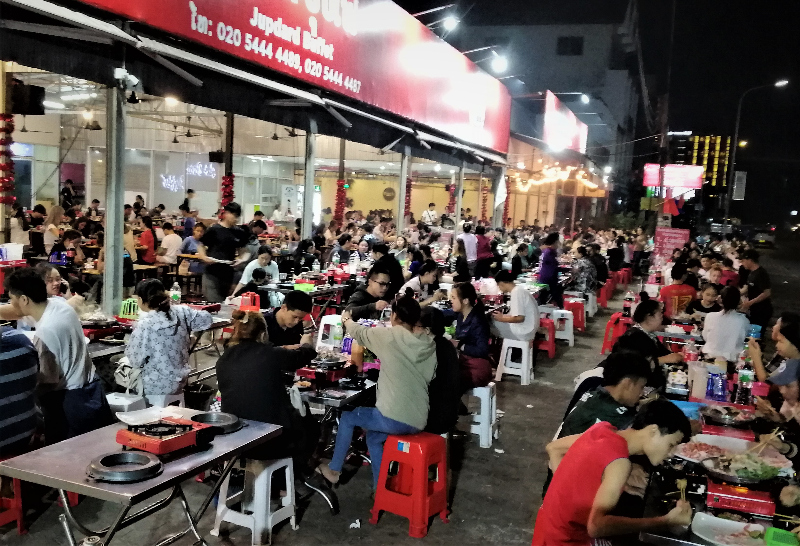 Many people sitting and eating at Jupdard Buffet restaurant in Vientiane, Laos.