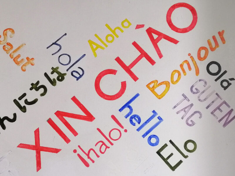 Colorful mural shows how to say hello in 11 languages.