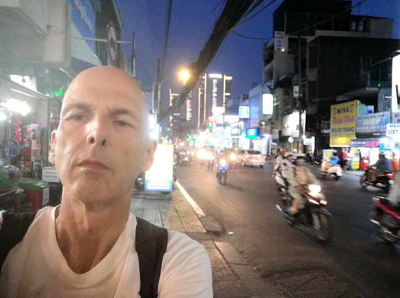 Sefie on a busy street in the evening, Ho Ch Min City, Vietnam.